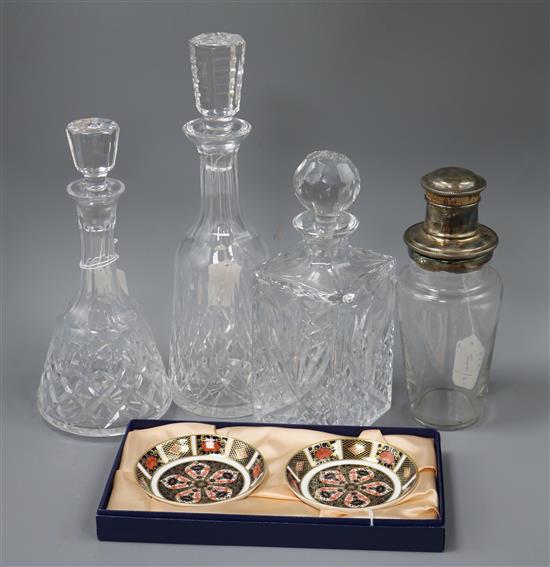 A plated and glass cocktail shaker, three cut glass decanters and a pair of Royal Crown Derby Imari dishes, boxed